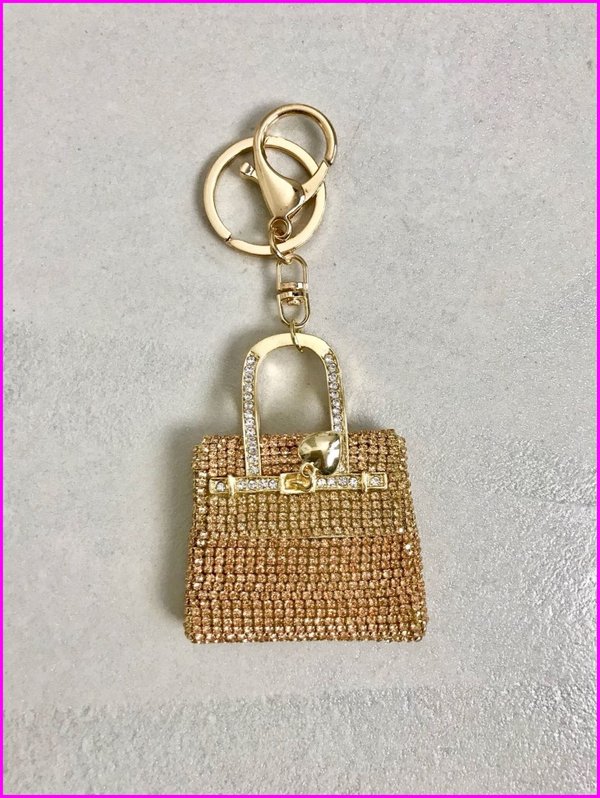 Charms mini bag in swarovski dorato.